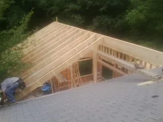 Framing a new roof addition that ties into an existing shingle roof in New Haven